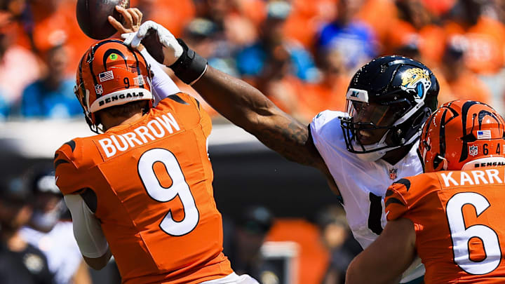 Sep 14, 2025; Cincinnati, Ohio, USA; Jacksonville Jaguars defensive end Travon Walker (44) blocks a pass by Cincinnati Bengals quarterback Joe Burrow (9) in the first half at Paycor Stadium. Mandatory Credit: Katie Stratman-Imagn Images