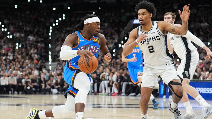 May 24, 2026; San Antonio, Texas, USA; Oklahoma City Thunder forward Luguentz Dort (5) drives the ball while defended by San Antonio Spurs guard Dylan Harper (2) in the fourth quarter during game four of the western conference finals for the 2026 NBA playoffs at Frost Bank Center. Mandatory Credit: Daniel Dunn-Imagn Images May 24, 2026; San Antonio, Texas, USA; Oklahoma City Thunder forward Luguentz Dort (5) drives the ball while defended by San Antonio Spurs guard Dylan Harper (2) in the fourth quarter during game four of the western conference finals for the 2026 NBA playoffs at Frost Bank Center. Mandatory Credit: Daniel Dunn-Imagn Images