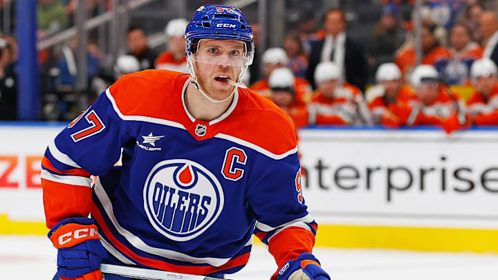 Mar 4, 2025; Edmonton, Alberta, CAN; Edmonton Oilers forward Connor McDavid (97) looks for a loose puck against the Anaheim Ducks at Rogers Place. Mandatory Credit: Perry Nelson-Imagn Images