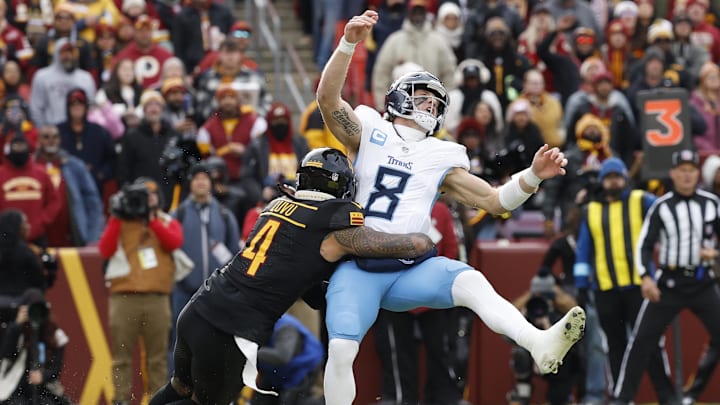 Dec 1, 2024; Landover, Maryland, USA; Tennessee Titans quarterback Will Levis (8) is hit while passing the ball by Washington Commanders linebacker Frankie Luvu (4) during the first quarter at Northwest Stadium. Mandatory Credit: Geoff Burke-Imagn Images Dec 1, 2024; Landover, Maryland, USA; Tennessee Titans quarterback Will Levis (8) is hit while passing the ball by Washington Commanders linebacker Frankie Luvu (4) during the first quarter at Northwest Stadium. Mandatory Credit: Geoff Burke-Imagn Images