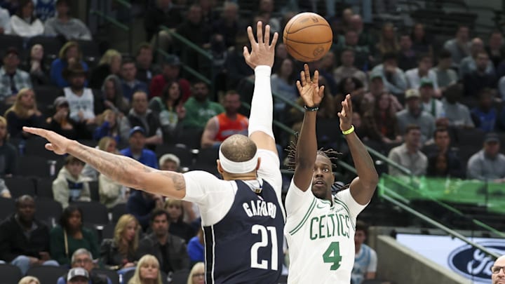 Jan 25, 2025; Dallas, Texas, USA; Boston Celtics guard Jrue Holiday (4) shoots over Dallas Mavericks center Daniel Gafford (21) during the second half at American Airlines Center. Mandatory Credit: Kevin Jairaj-Imagn Images