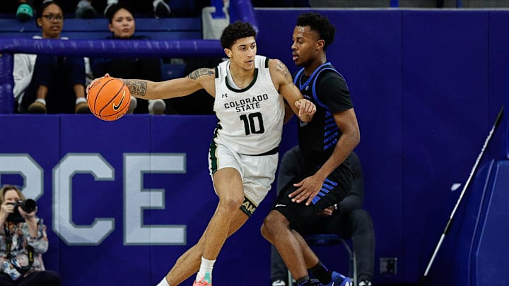 Feb 25, 2025; Colorado Springs, Colorado, USA; Colorado State Rams guard Nique Clifford (10) controls the ball as Air Force Falcons guard Ethan Taylor (5) guards in the second half at Clune Arena. Mandatory Credit: Isaiah J. Downing-Imagn Images