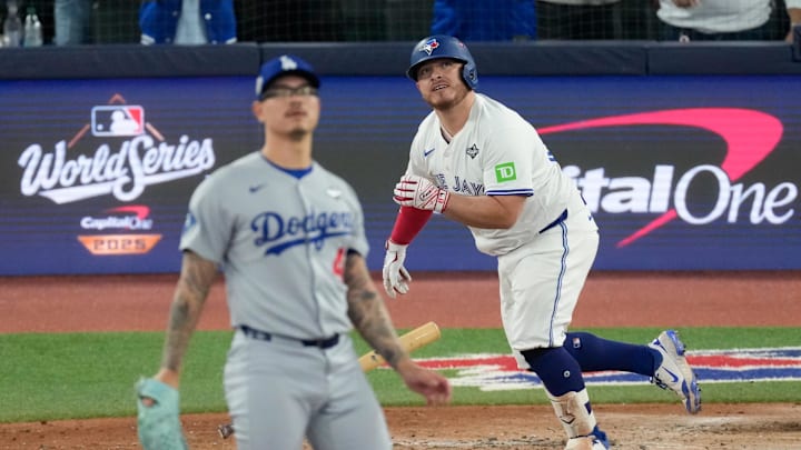 Oct 24, 2025; Toronto, Ontario, CAN; Los Angeles Dodgers pitcher Anthony Banda (43) reacts as Toronto Blue Jays catcher Alejandro Kirk (30) watches after hitting a two-run home run in the sixth inning during game one of the 2025 MLB World Series at Rogers Centre. Mandatory Credit: Kevin Sousa-Imagn Images