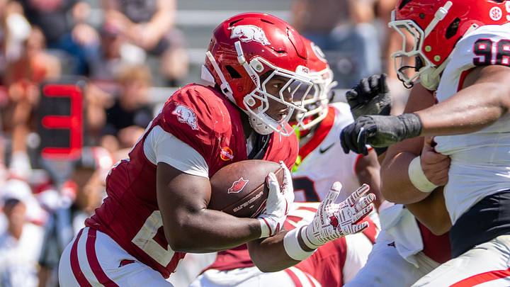 Arkansas Razorbacks running back Cam Settles looks for running room in the second half against the Georgia Bulldogs. Arkansas Razorbacks running back Cam Settles looks for running room in the second half against the Georgia Bulldogs.