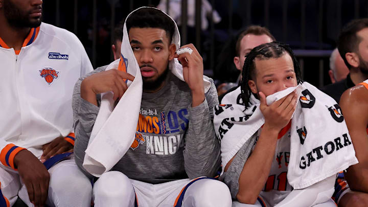 Jan 10, 2025; New York, New York, USA; New York Knicks center Karl-Anthony Towns (32) and guards Jalen Brunson (11) and Miles McBride (2) watch from the bench during the fourth quarter against the Oklahoma City Thunder at Madison Square Garden. Mandatory Credit: Brad Penner-Imagn Images