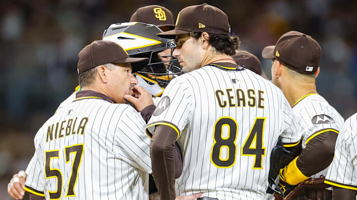 Apr 14, 2025; San Diego, California, USA; San Diego Padres pitching coach Ruben Niebla (57) speaks with San Diego Padres starting pitcher Dylan Cease (84) during the fifth inning against the Chicago Cubs at Petco Park. Mandatory Credit: David Frerker-Imagn Images