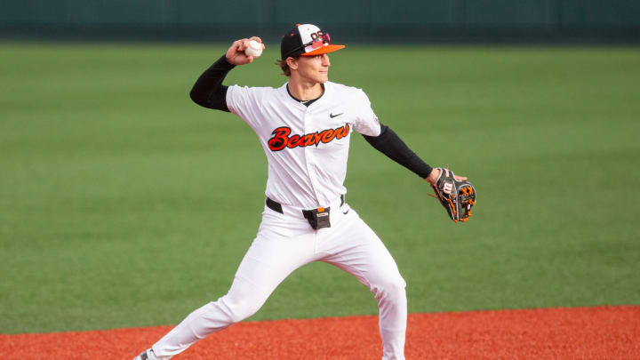 Oregon State's Elijah Hainline (3) throws the ball to first base duringÊthe NCAA college baseball game at Goss Stadium on Friday,ÊApril 26, 2024, in Corvallis, Ore.