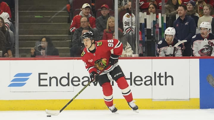 Dec 1, 2024; Chicago, Illinois, USA; Chicago Blackhawks center Connor Bedard (98) looks to pass against the Columbus Blue Jackets during the first period at United Center. Mandatory Credit: David Banks-Imagn Images
