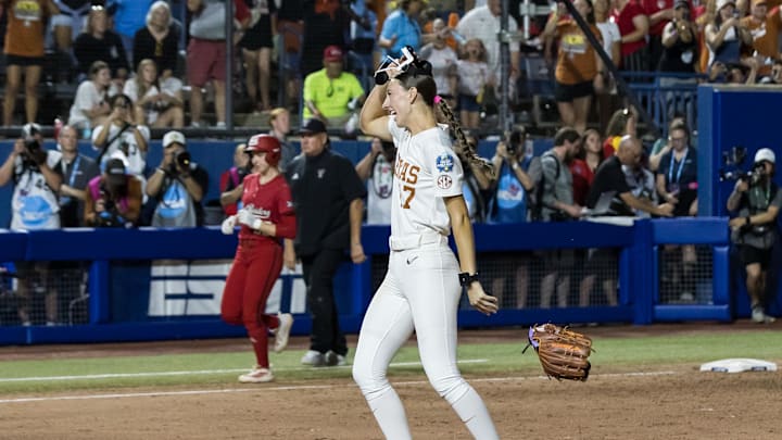 Jun 6, 2025; Oklahoma City, OK, USA;  Texas Longhorns pitcher Teagan Kavan (17) drops her glove and takes off her mask after winning the National Championship 10-4 against Texas Tech Red Raiders in game three of the NCAA Softball Women's College World Series finals at Devon Park. Mandatory Credit: Brett Rojo-Imagn Images