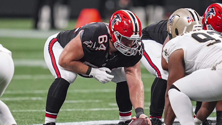 Sep 29, 2024; Atlanta, Georgia, USA; Atlanta Falcons guard Ryan Neuzil (64) in action against the New Orleans Saints at Mercedes-Benz Stadium. Mandatory Credit: Dale Zanine-Imagn Images