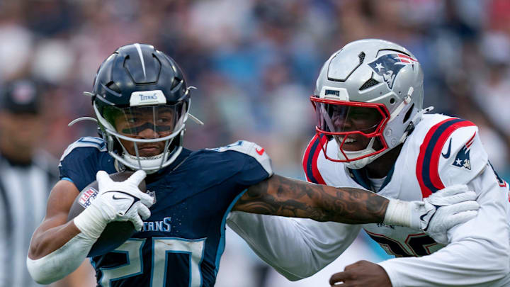 Keion White of the Patriots tracks down running back Tony Pollard last season.