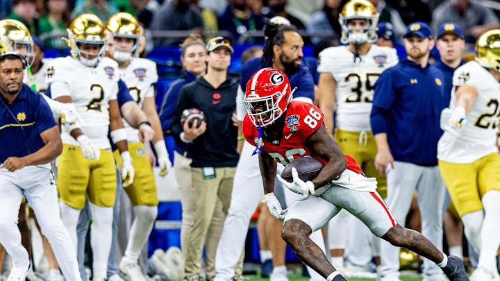 Jan 2, 2025; New Orleans, LA, USA; Georgia Bulldogs wide receiver Dillon Bell (86) runs with the ball during the first quarter against the Notre Dame Fighting Irish at Caesars Superdome. Mandatory Credit: Stephen Lew-Imagn Images