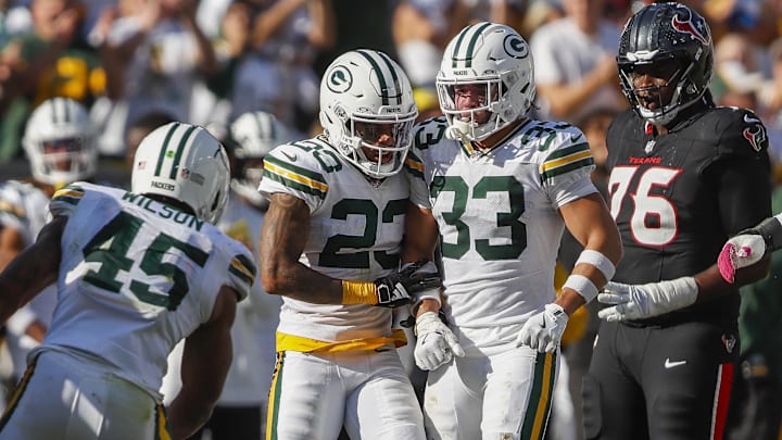 Oct 20, 2024; Green Bay, Wisconsin, USA;  Green Bay Packers cornerback Jaire Alexander (23) talks trash to Houston Texans running back Joe Mixon (28) after a play  at Lambeau Field. Mandatory Credit: Tork Mason/Green Bay Press-Gazette via the USA TODAY NETWORK-Wisconsin-Imagn Images