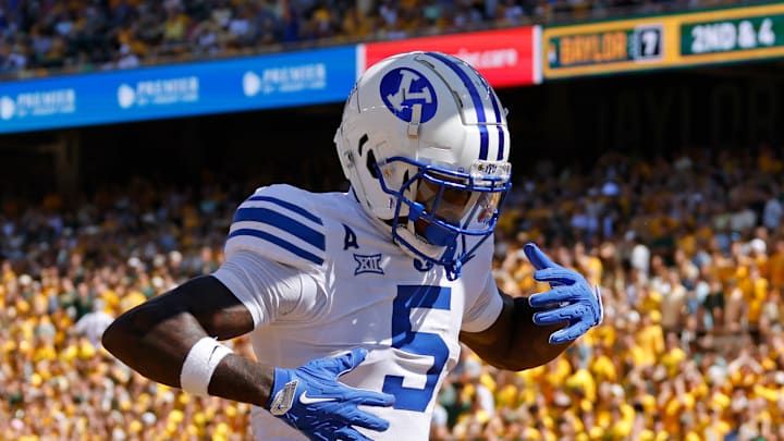 Darius Lassiter celebrates in the end zone after scoring a touchdown against Baylor