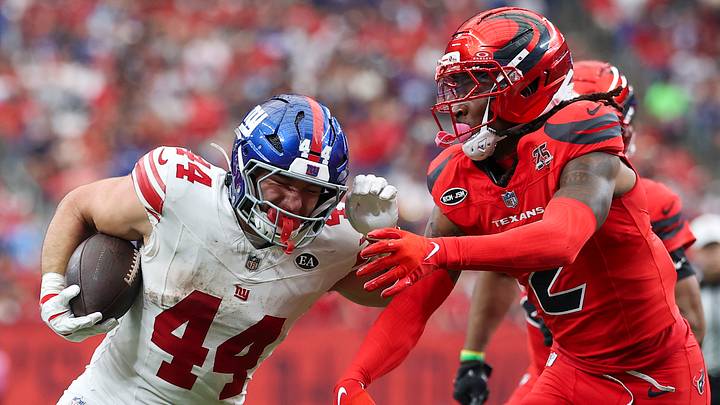 Oct 25, 2026; Houston, Texas, USA;  New York Giants running back Cam Skattebo (44) runs with the ball and scores a touchdown as Houston Texans safety Calen Bullock (2) attempts to make a tackle during the fourth quarter at Reliant Stadium.  Mandatory Credit: Troy Taormina-Imagn Images