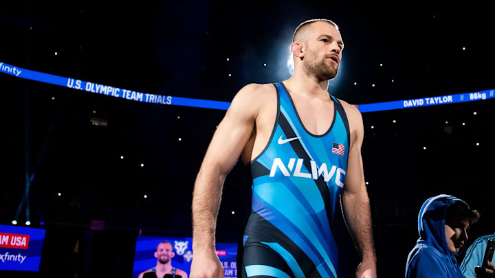 David Taylor is introduced before the 86 kg freestyle championship series at the 2024 U.S. Olympic Wrestling Trials. David Taylor is introduced before the 86 kg freestyle championship series at the 2024 U.S. Olympic Wrestling Trials.