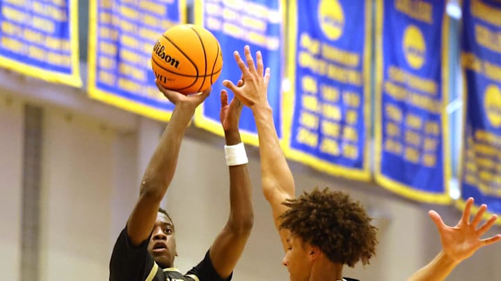 Utah Prep's AJ Dybantsa shoots the ball over Highland's Nate Ament during a game at Emmanuel College in Boston on Tuesday, Nov. 5, 2024.