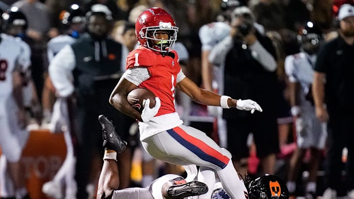 Brentwood Academy's Kesean Bowman (1) evades Ensworth's Bishop Starling (0) during the first quarter at Brentwood Academy in Brentwood, Tenn., Friday, Sept. 26, 2025. Brentwood Academy's Kesean Bowman (1) evades Ensworth's Bishop Starling (0) during the first quarter at Brentwood Academy in Brentwood, Tenn., Friday, Sept. 26, 2025.