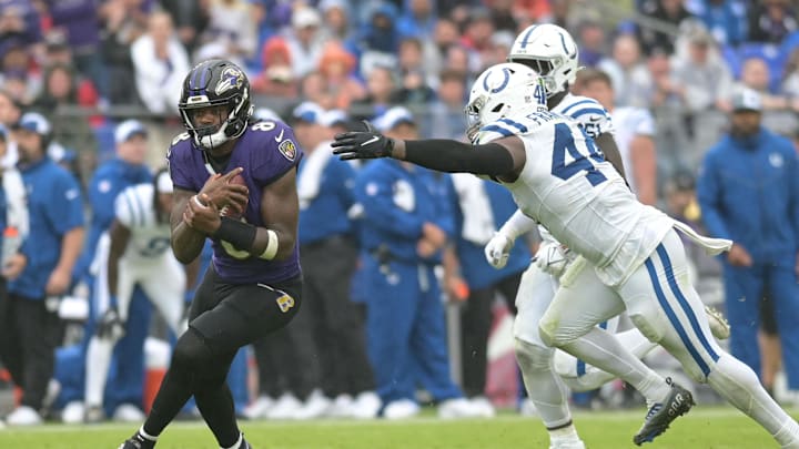 Sep 24, 2023; Baltimore, Maryland, USA; Baltimore Ravens quarterback Lamar Jackson (8) runs by Indianapolis Colts linebacker Zaire Franklin (44) during the second half  at M&T Bank Stadium. Mandatory Credit: Tommy Gilligan-Imagn Images