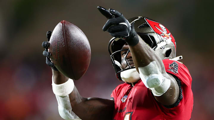 Oct 21, 2024; Tampa, Florida, USA; Tampa Bay Buccaneers wide receiver Chris Godwin (14) celebrates a first down against the Baltimore Ravens in the second quarter at Raymond James Stadium. Mandatory Credit: Nathan Ray Seebeck-Imagn Images