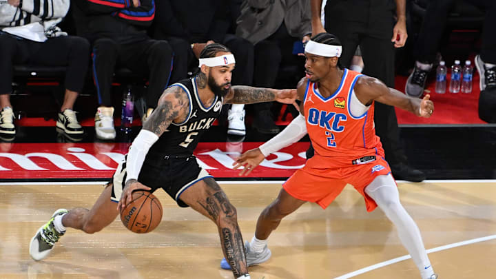Dec 17, 2024; Las Vegas, Nevada, USA; Milwaukee Bucks guard Gary Trent Jr. (5) dribbles against Oklahoma City Thunder guard Shai Gilgeous-Alexander (2) during the 3rd quarter of the Emirates NBA Cup championship game at T-Mobile Arena. Mandatory Credit: Candice Ward-Imagn Images