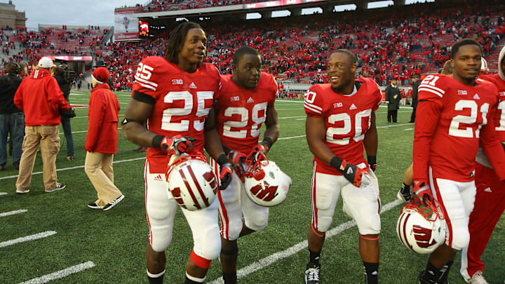 Oct 6, 2012; Madison, WI, USA; Wisconsin Badgers running backs Melvin Gordon (25), Montee Ball (28) and James White (20) walk off the field against the Illinois Fighting Illini at Camp Randall Stadium. The Badgers defeated the Fighting Illini 31-14. Mandatory Credit: Brace Hemmelgarn-Imagn Images