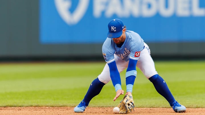 Apr 27, 2025; Kansas City, Missouri, USA; Kansas City Royals shortstop Bobby Witt Jr. (7) fields the ball during the ninth inning against the Houston Astros at Kauffman Stadium. Mandatory Credit: William Purnell-Imagn Images