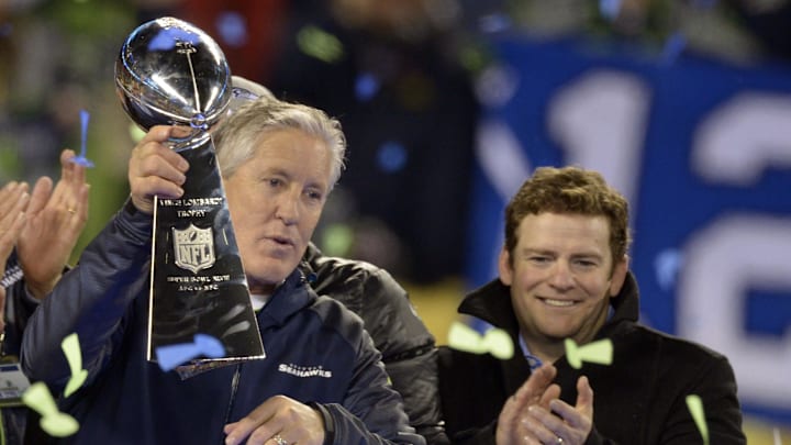 Feb 2, 2014; East Rutherford, NJ, USA; Seattle Seahawks head coach Pete Carroll (left) holds the Vince Lombardi Trophy after Super Bowl XLVIII against the Denver Broncos  at MetLife Stadium.  Mandatory Credit: Kirby Lee-Imagn Images