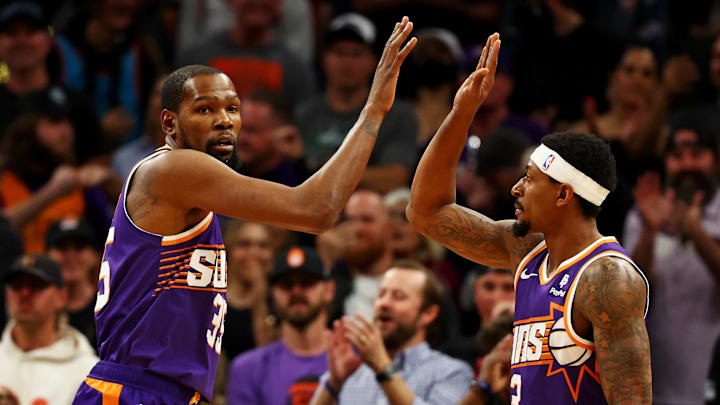 Mar 3, 2024; Phoenix, Arizona, USA; Phoenix Suns forward Kevin Durant (35) celebrates with guard Bradley Beal (3) during the first quarter of the game against the Oklahoma City Thunder at Footprint Center. Mandatory Credit: Mark J. Rebilas-Imagn Images