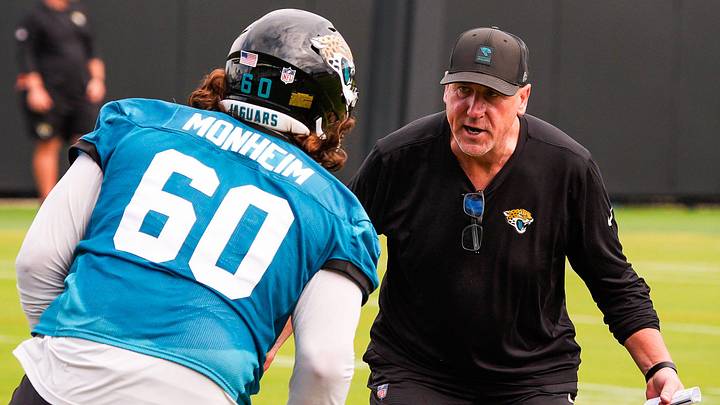 Jaguars run game coordinator Brian Picucci runs drills with offensive lineman Jonah Monheim (60) during the Jaguars’ fourth OTA of the year, Monday June 1, 2026 at the Miller Electric Center in Jacksonville, Fla. [Doug Engle/Florida Times-Union]