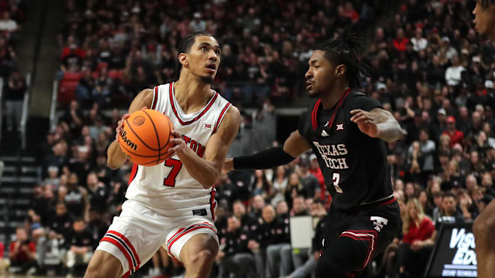 Feb 24, 2025; Lubbock, Texas, USA;  Houston Cougars guard Milos Uzan (7) looks to shoot against Texas Tech Red Raiders guard Elijah Hawkins (3) in the second half at United Supermarkets Arena. Mandatory Credit: Michael C. Johnson-Imagn Images