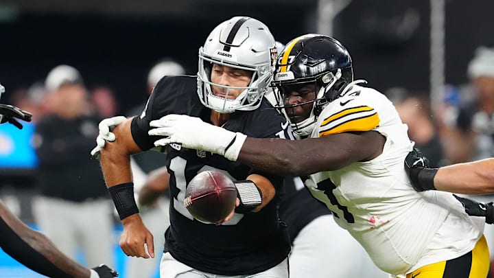 Sep 24, 2023; Paradise, Nevada, USA; Pittsburgh Steelers defensive tackle Montravius Adams (57) pressures Las Vegas Raiders quarterback Jimmy Garoppolo (10) during the first quarter at Allegiant Stadium. Mandatory Credit: Stephen R. Sylvanie-Imagn Images