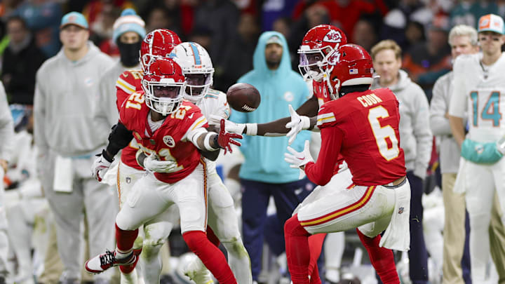 Nov 5, 2023; Frankfurt, Germany, ; Kansas City Chiefs safety Mike Edwards (21) tosses the ball back to safety Bryan Cook (6) against the Miami Dolphins in the second quarter during an NFL International Series game at Deutsche Bank Park. Mandatory Credit: Nathan Ray Seebeck-Imagn Images Nov 5, 2023; Frankfurt, Germany, ; Kansas City Chiefs safety Mike Edwards (21) tosses the ball back to safety Bryan Cook (6) against the Miami Dolphins in the second quarter during an NFL International Series game at Deutsche Bank Park. Mandatory Credit: Nathan Ray Seebeck-Imagn Images