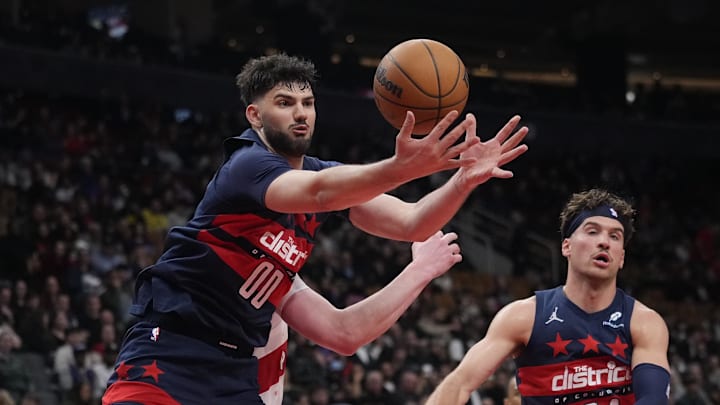 Mar 10, 2025; Toronto, Ontario, CAN; Washington Wizards forward Tristan Vukcevic (00) gets a rebound against the Toronto Raptors during the second half at Scotiabank Arena. Mandatory Credit: John E. Sokolowski-Imagn Images