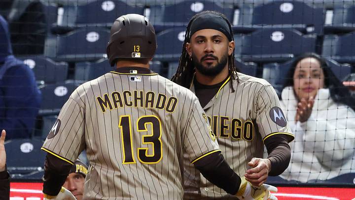 Apr 6, 2026; Pittsburgh, Pennsylvania, USA;  San Diego Padres right fielder Fernando Tatis Jr. (right) greets third baseman Manny Machado (13) returning to the dugout after Machado scored a run against the Pittsburgh Pirates during the fourth inning at PNC Park. Mandatory Credit: Charles LeClaire-Imagn Images