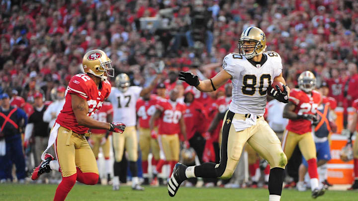 Jan 14, 2012; San Francisco, CA, USA; New Orleans Saints tight end Jimmy Graham (80) runs with the ball past San Francisco 49ers cornerback Carlos Rogers (22) during the fourth quarter of the 2011 NFC divisional playoff game at Candlestick Park. The 49ers defeated the Saints 36-32. Mandatory Credit: Kyle Terada-Imagn Images
