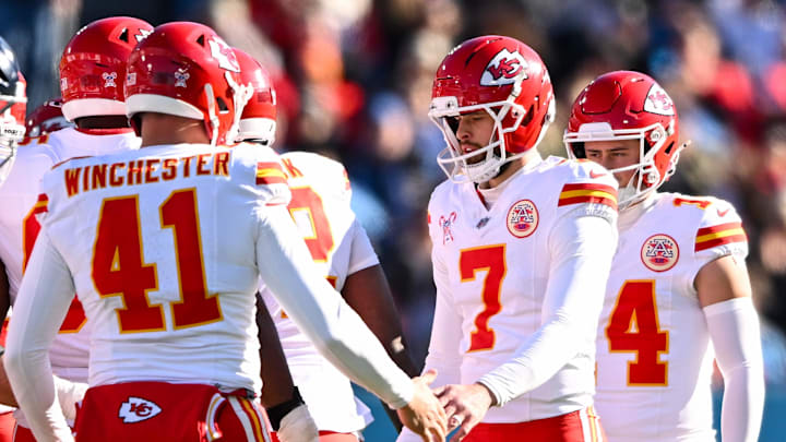 Dec 21, 2025; Nashville, Tennessee, USA;  Kansas City Chiefs long snapper James Winchester (41) celebrates the made field goal of place kicker Harrison Butker (7) against the Tennessee Titans during the first half at Nissan Stadium. Mandatory Credit: Steve Roberts-Imagn Images