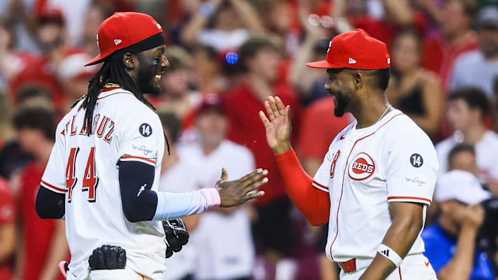 Aug 13, 2025; Cincinnati, Ohio, USA; Cincinnati Reds shortstop Elly De La Cruz (44) high fives designated hitter Miguel Andujar (38) after the victory over the Philadelphia Phillies at Great American Ball Park. Mandatory Credit: Katie Stratman-Imagn Images