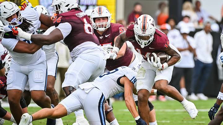 Sep 12, 2026; Blacksburg, Virginia, USA; Virginia Tech Hokies running back Jeffrey Overton Jr. (16) runs the ball as Old Dominion Monarchs safety Lucas Struck (19) defends during the first quarter at Lane Stadium. Mandatory Credit: Brian Bishop-Imagn Images Sep 12, 2026; Blacksburg, Virginia, USA; Virginia Tech Hokies running back Jeffrey Overton Jr. (16) runs the ball as Old Dominion Monarchs safety Lucas Struck (19) defends during the first quarter at Lane Stadium. Mandatory Credit: Brian Bishop-Imagn Images