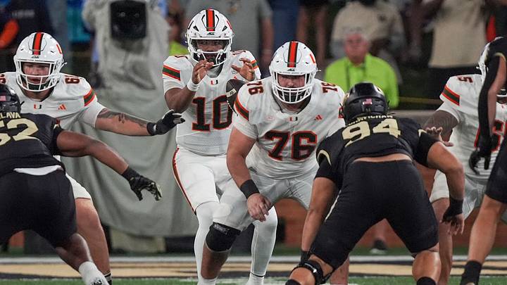 Sep 18, 2026; Winston-Salem, North Carolina, USA;  Miami (FL) Hurricanes quarterback Darian Mensah (10) takes the snap from Miami (FL) Hurricanes offensive lineman Ryan Rodriguez (76) during the first half at Allegacy Federal Credit Union Stadium.  Mandatory Credit: Jim Dedmon-Imagn Images