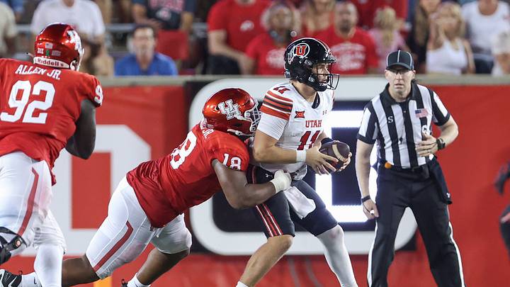 Houston DL Anthony Holmes Jr. attempts to tackle Utah QB Isaac Wilson. Mandatory Credit: Troy Taormina-Imagn Images Houston DL Anthony Holmes Jr. attempts to tackle Utah QB Isaac Wilson. Mandatory Credit: Troy Taormina-Imagn Images