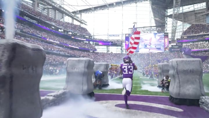 Vikings RB Aaron Jones runs onto the field before Sunday's game against the Ravens.
