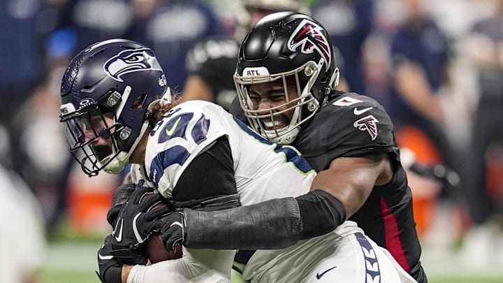 Dec 7, 2025; Atlanta, Georgia, USA; Seattle Seahawks tight end AJ Barner (88) is tackled by Atlanta Falcons linebacker Divine Deablo (0) during the second half at Mercedes-Benz Stadium. Mandatory Credit: Dale Zanine-Imagn Images Dec 7, 2025; Atlanta, Georgia, USA; Seattle Seahawks tight end AJ Barner (88) is tackled by Atlanta Falcons linebacker Divine Deablo (0) during the second half at Mercedes-Benz Stadium. Mandatory Credit: Dale Zanine-Imagn Images