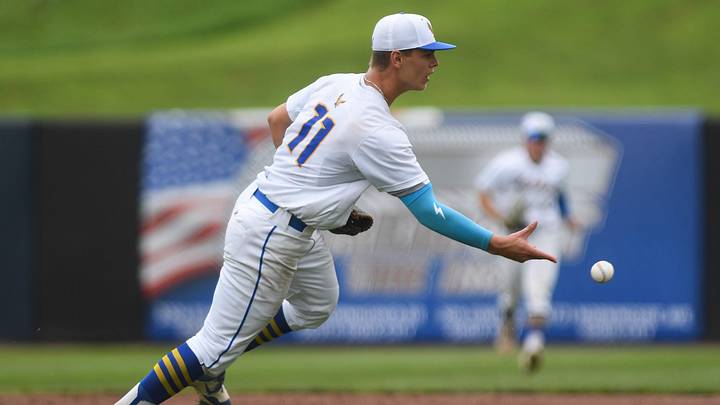 Wahlert Catholic senior Will Pierro (11) catches the hit and tosses it to first base during the Iowa high school baseball state championship on Friday, July 25, 2025, at Lewis & Clark Park in Sioux City, Iowa. Wahlert Catholic senior Will Pierro (11) catches the hit and tosses it to first base during the Iowa high school baseball state championship on Friday, July 25, 2025, at Lewis & Clark Park in Sioux City, Iowa.
