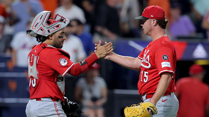 Jul 18, 2025; New York City, New York, USA; Cincinnati Reds catcher Jose Trevino (35) and relief pitcher Emilio Pagan (15) celebrate after defeating the New York Mets at Citi Field. Mandatory Credit: Brad Penner-Imagn Images