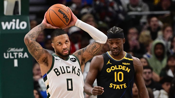 Feb 10, 2025; Milwaukee, Wisconsin, USA; Milwaukee Bucks guard Damian Lillard (0) reacts after a foul call in the third quarter against the Golden State Warriors at Fiserv Forum. Mandatory Credit: Benny Sieu-Imagn Images