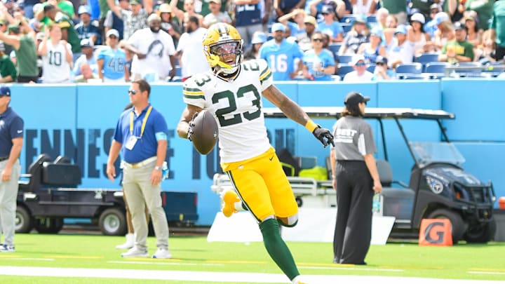 Sep 22, 2024; Nashville, Tennessee, USA;  Green Bay Packers cornerback Jaire Alexander (23) scores on a pick six thrown by Tennessee Titans Will Levis (8) during the first half at Nissan Stadium. Mandatory Credit: Steve Roberts-Imagn Images