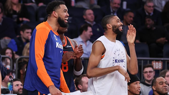 Mar 25, 2025; New York, New York, USA;  New York Knicks center Karl-Anthony Towns (32) and forward Mikal Bridges (25) celebrate during the closing seconds of the fourth quarter against the Dallas Mavericks at Madison Square Garden. Mandatory Credit: Wendell Cruz-Imagn Images