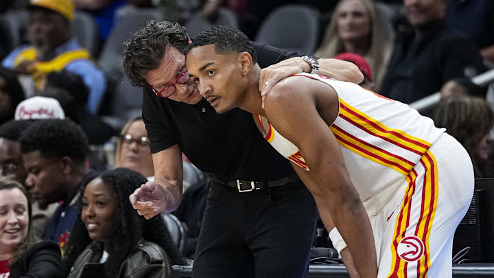 Atlanta Hawks head coach Quin Snyder talks to guard Kobe Bufkin during the game against the Cleveland Cavaliers during the second half