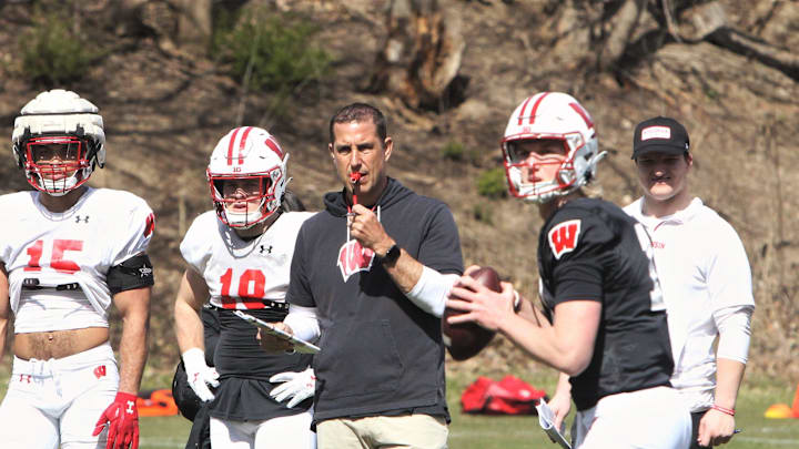 Wisconsin coach Luke Fickell watches as quarterback Mabrey Mettauer throws a pass during practice just outside Camp Randall Stadium in Madison, Wisconsin on Saturday April 7, 2024.